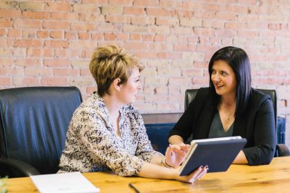 Business Meeting, two ladies sat at a table talking