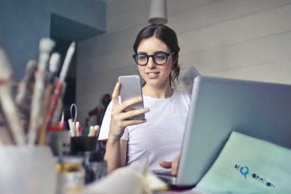 Office worker looking at her phone