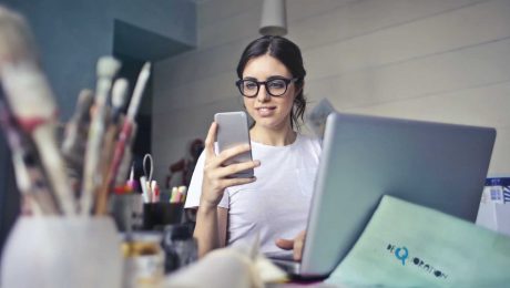 Office worker looking at her phone