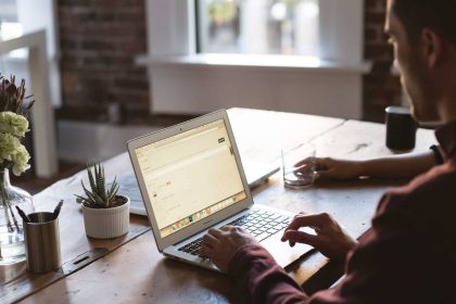 Working man on his laptop surrounded by plants