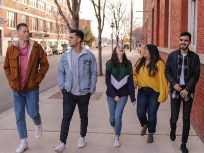 Group of young people walking on a street