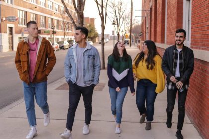 Group of young people walking on a street