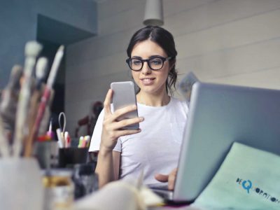 Office worker looking at her phone