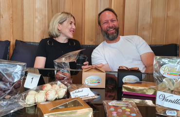 Chocolate business pictured at their shop with all their products