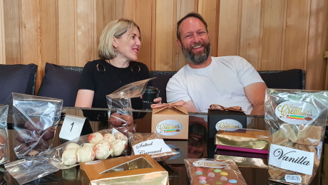 Chocolate business pictured at their shop with all their products