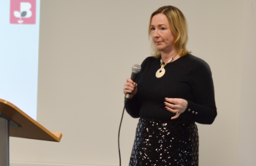 Lady from the British Chambers of Commerce presenting holding a microphone