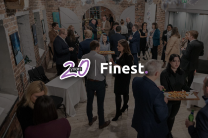 Finest-20-Years People networking at an event being presented with canapes