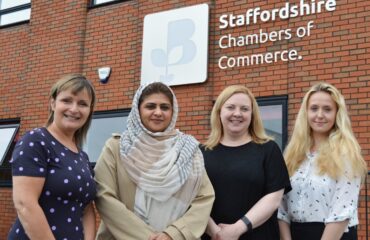 With a supported refugee, Positive Pathways Programme is pictured in front of Staffordshire Chambers of Commerce.