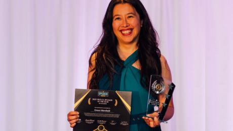 Grace Marshall, at the Speaker Awards holding her certificate and award