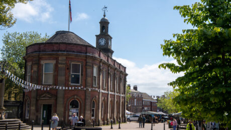 Newcastle-under-Lyme City Centre surrounded by shops, marquees and many shoppers