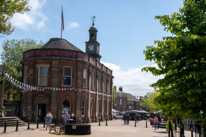 Newcastle-under-Lyme City Centre surrounded by shops, marquees and many shoppers