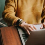 Picture of someone typing on a computer.