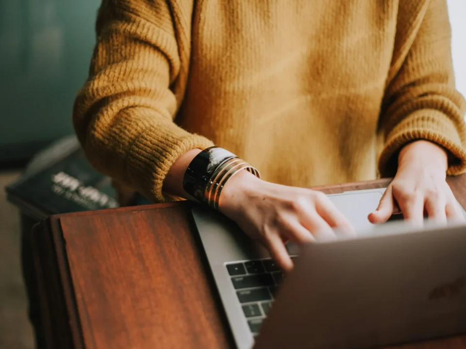 Picture of someone typing on a computer.