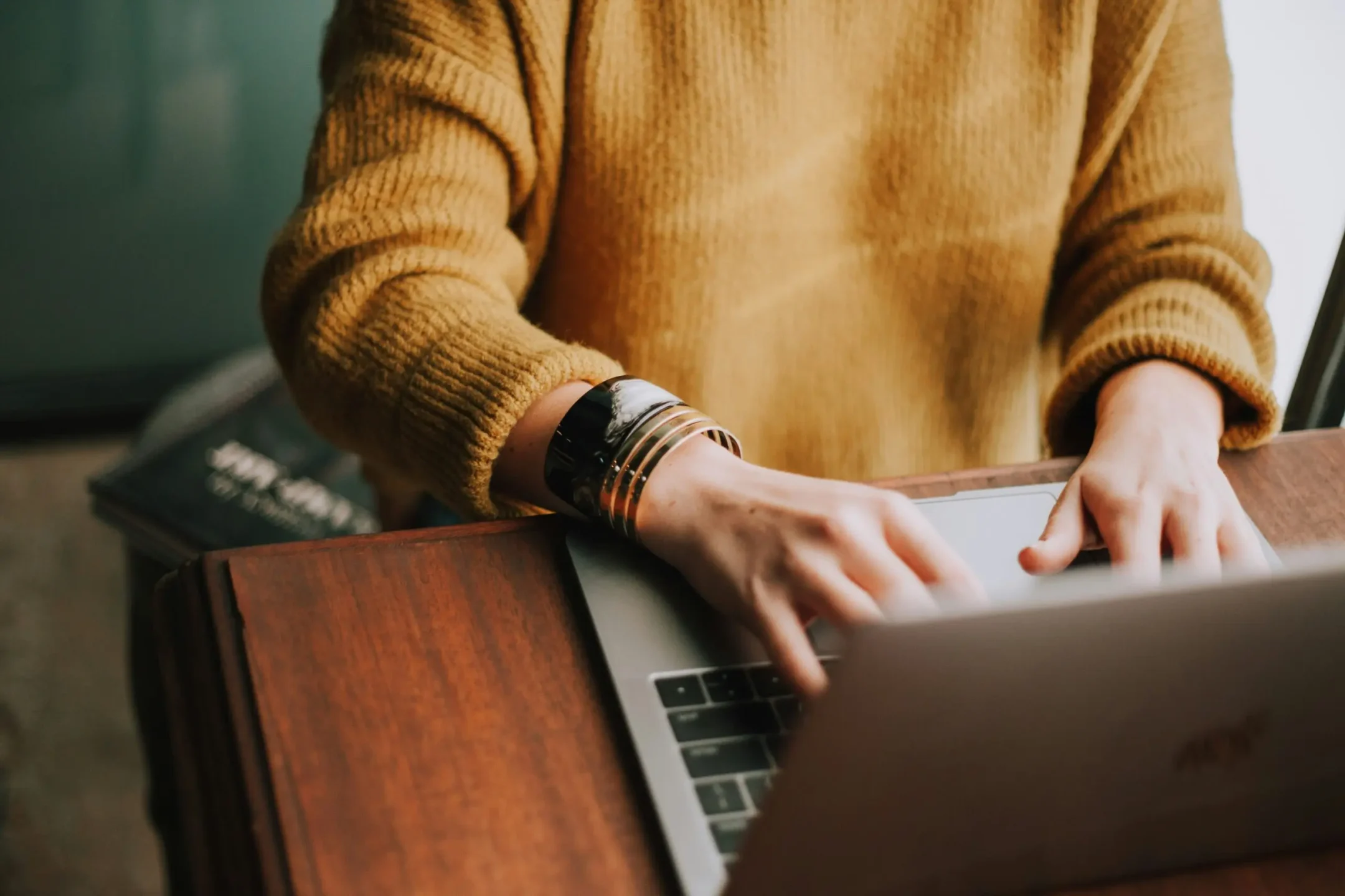 Picture of someone typing on a computer.