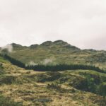 Picture of a mountain and some hills in nature.