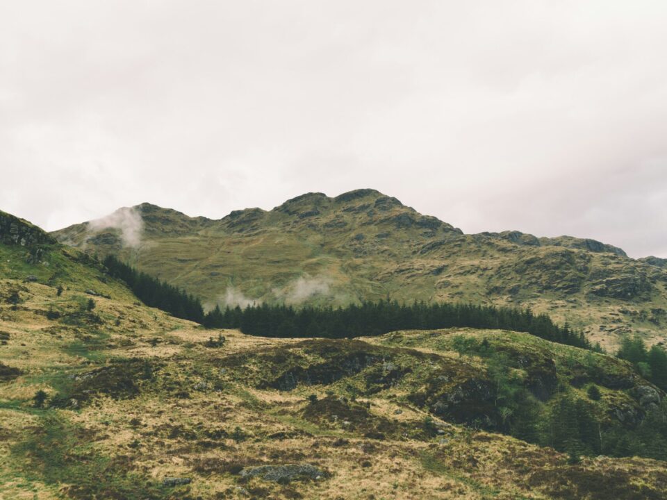 Picture of a mountain and some hills in nature.