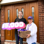 Picture of two people at a house with one holding a basket and refers tot he 15, 000 new customers of Lila broadband.