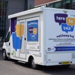 Picture of a well being buss to visit members and staff at commerce house.