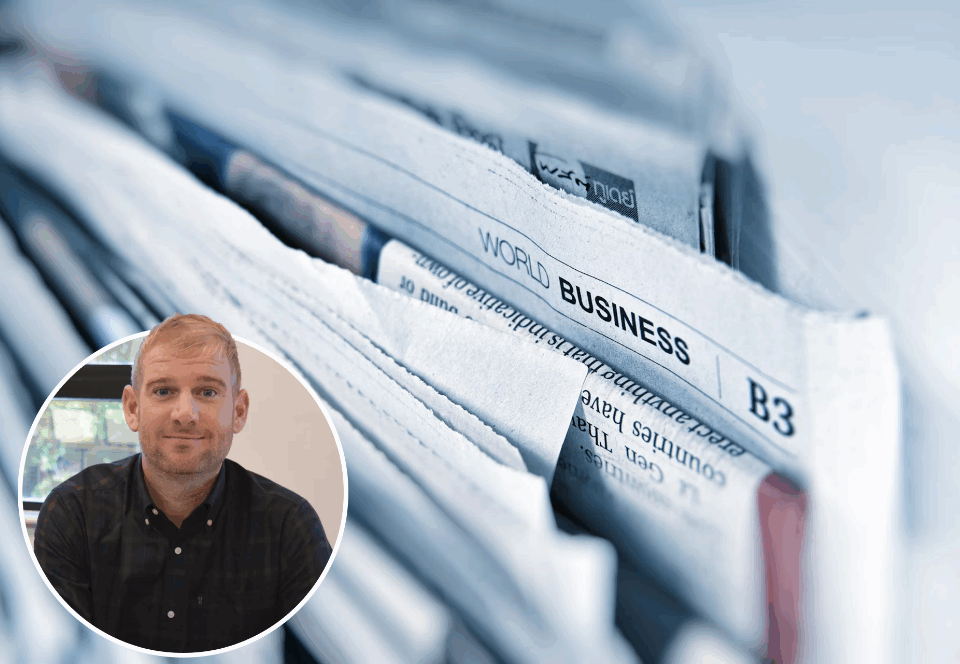 Picture of Chris plant and some newsletters behind him.