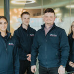 Picture of employees at spotless standing together.