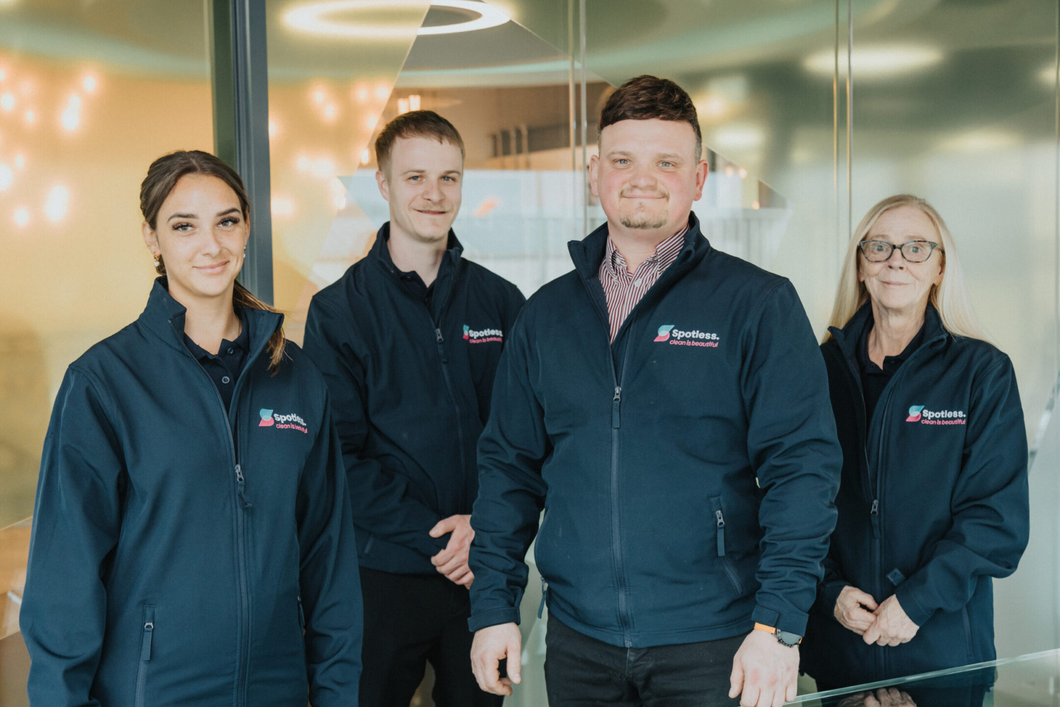 Picture of employees at spotless standing together.
