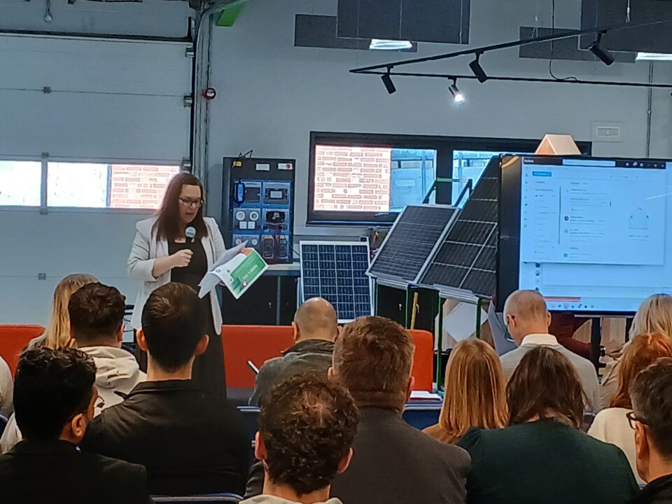People at the AI Show and Tell Event Sitting whilst listening to a speaker.