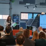 People at the AI Show and Tell Event Sitting whilst listening to a speaker.