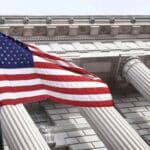 Picture of the Flag of the united states of America Infront of the white house