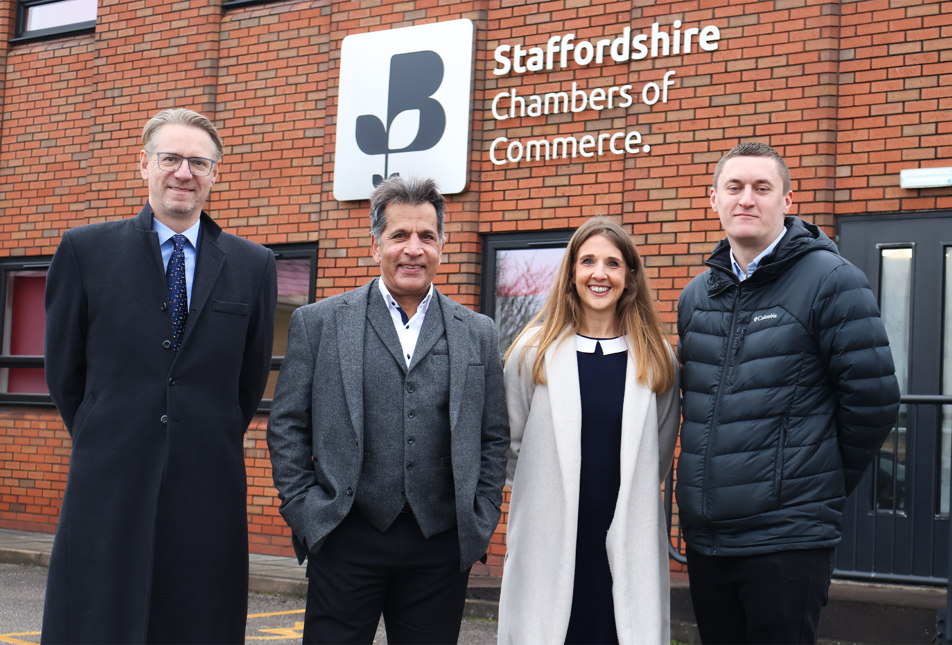Deputy Chief Executive Tom Nadin stood outside the Staffordshire Chambers building with 1 woman and 2 men.