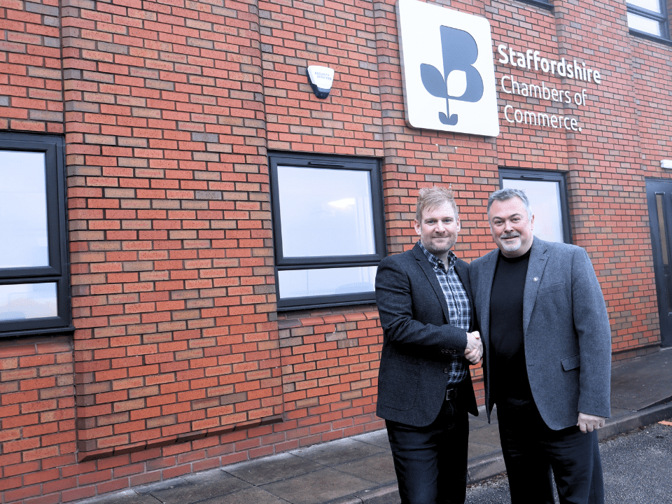 Jon Rye and Chris plant shaking hands Infront of Staffordshire chambers of commerce