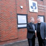 Jon Rye and Chris plant shaking hands Infront of Staffordshire chambers of commerce